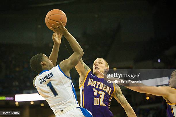 Austin Chatman of the Creighton Bluejays shoots against Marc Sonnen and Jake Koch of the Northern Iowa Panthers during a game at the CenturyLink...