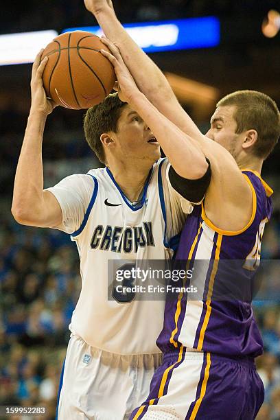 Doug McDermott of the Creighton Bluejays goes up for a shot against Jake Koch of the Northern Iowa Panthers during their game at the CenturyLink...