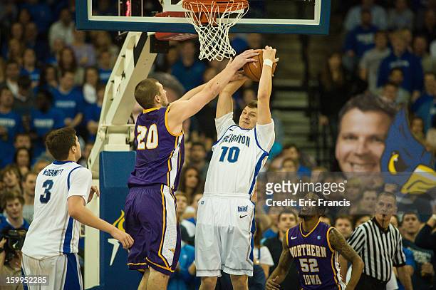Grant Gibbs of the Creighton Bluejays battles for a rebound with Jake Koch of the Northern Iowa Panthers during their game at the CenturyLink Center...