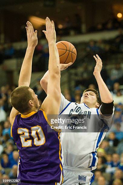 Doug McDermott of the Creighton Bluejays shoots over Jake Koch of the Northern Iowa Panthers during a game at the CenturyLink Center on January 15,...