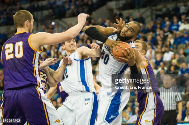 Gregory Echenique of the Creighton Bluejays pulls in a rebound against Jake Koch of the Northern Iowa Panthers during a game at the CenturyLink...