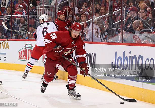 Alex Bolduc of the Phoenix Coyotes skates with the puck during the first period of the NHL game against the Columbus Blue Jackets at Jobing.com Arena...