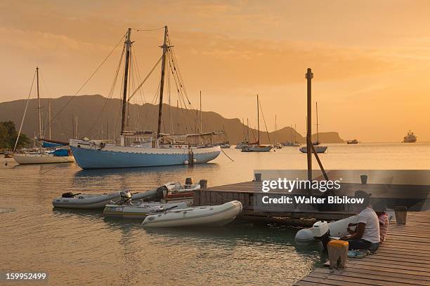 bequia, st. vincent, harbor, dusk - bequia stock-fotos und bilder