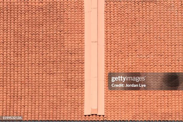 modern roof with terracotta roof clay tiles - roof texture stock pictures, royalty-free photos & images