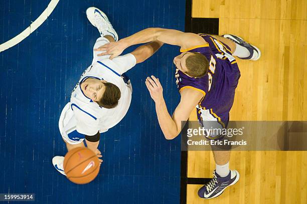 Doug McDermott of the Creighton Bluejays and Jake Koch of the Northern Iowa Panthers battle for position during a game at the CenturyLink Center on...