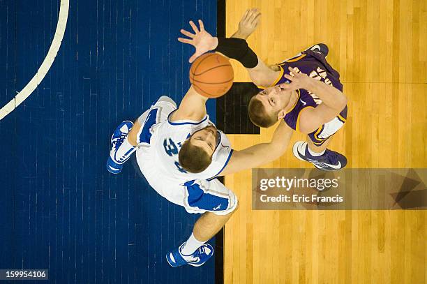 Seth Tuttle of the Northern Iowa Panthers and Ethan Wragge of the Creighton Bluejays battle for a rebound during their game at the CenturyLink Center...