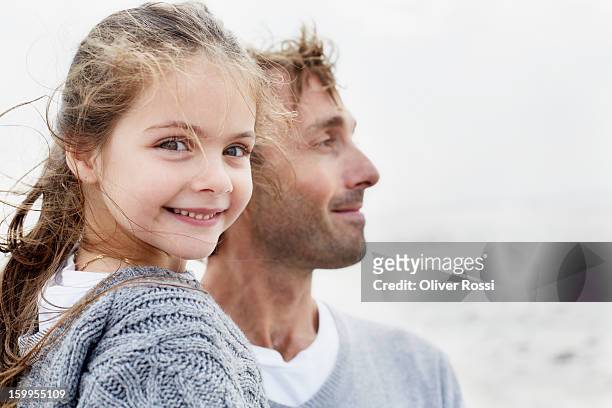 smiling girl with father outdoors - 6 year old blonde girl stock pictures, royalty-free photos & images