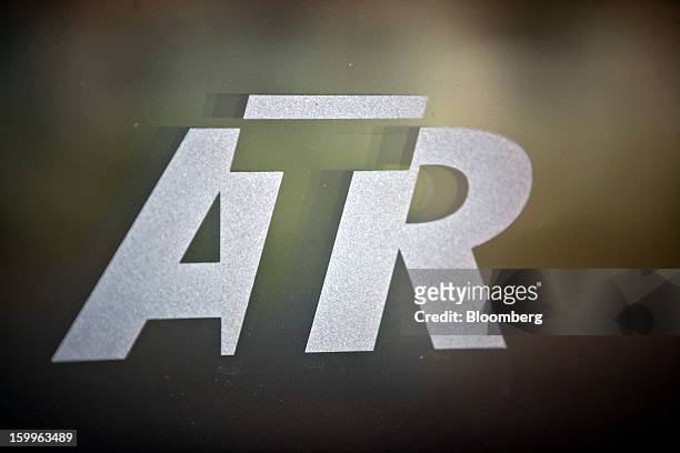 Logo sits on a window at Avions de Transport Regional's turboprop aircraft production facility in Colomiers, France, on Wednesday, Jan. 23, 2013....