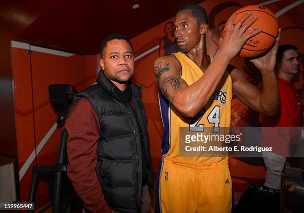 Actor Cuba Gooding Jr. Poses next to a wax figure of NBA player Kobe Bryant as he attends Relativity Media's "Movie 43" Los Angeles Premiere After...