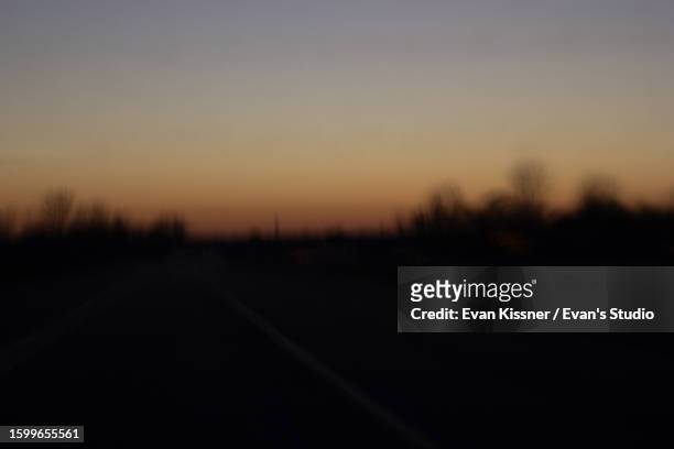 abstract and mysterious empty road at sunset - evan kissner stock pictures, royalty-free photos & images