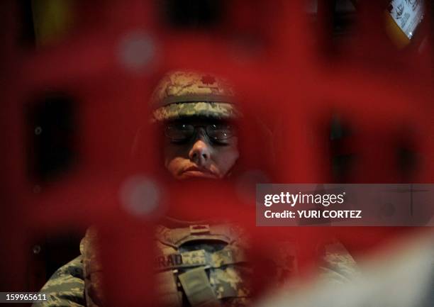 Female US soldier is seen on board an Australian C-130 military airplane with other NATO soldiers while en route to Kandahar on July 31, 2010. NATO...