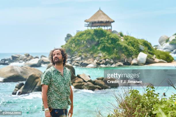 happy man in cabo san juan in tayrona national park in colombia - magdalena department colombia stock pictures, royalty-free photos & images