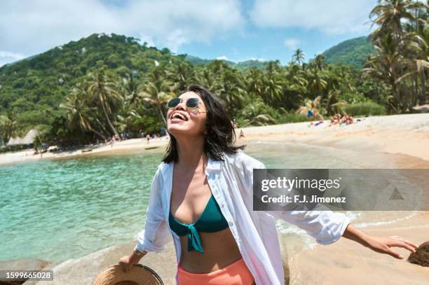 portrait of smiling woman in tayrona national park, colombia - columbia south america stock pictures, royalty-free photos & images