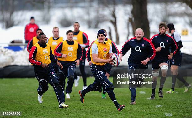 England fly half Toby Flood passes the ball during England training at West Park Rugby club on January 24, 2013 in Leeds, England.
