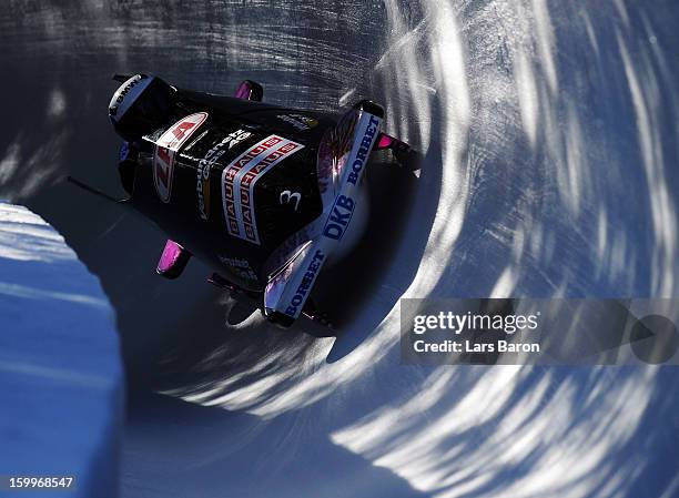 Sandra Kiriasis and Berit Wiacker of Germany take a run during a training session at Olympia Bob Run on January 24, 2013 in St Moritz, Switzerland.