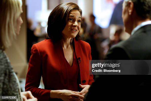 Sheryl Sandberg, chief operating officer of Facebook Inc., center, speaks during a television interview on day two of the World Economic Forum in...