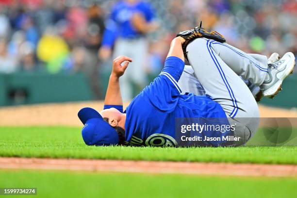 Starting pitcher Hyun Jin Ryu of the Toronto Blue Jays reacts after being hit by a line drive off the bat of Oscar Gonzalez of the Cleveland...