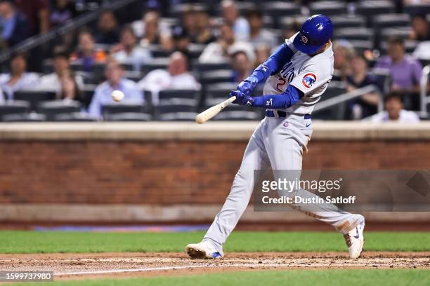 Cody Bellinger of the Chicago Cubs hits a RBI single during the third inning of the game against the New York Mets at Citi Field on August 07, 2023...
