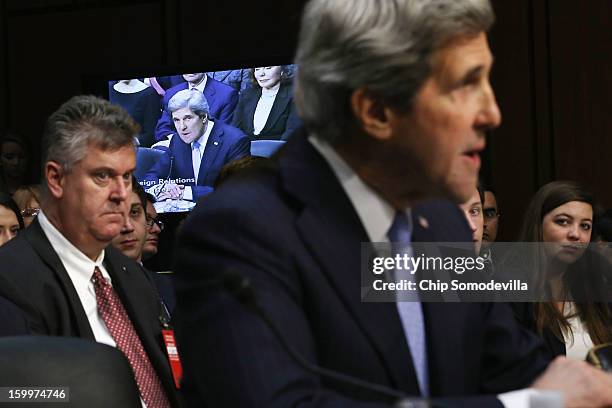 Sen. John Kerry gives an opening statement during his confirmation hearing before the Senate Foreign Relations Committee to become the next Secretary...