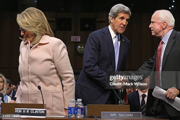 Sen. John Kerry thanks Sen. John McCain after he and U.S. Secretary of State Hillary Clinton introduced Kerry during his confirmation hearing before...