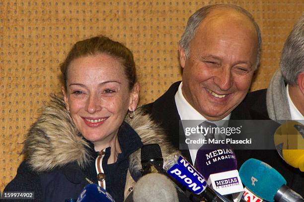 French Foreign Minister Laurent Fabius and Florence Cassez arrive to attend a Press conference following her release from prison in Mexico at...
