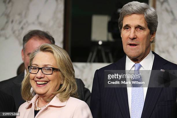 Secretary of State Hillary Clinton and Sen. John Kerry arrive for Kerry's confirmation hearing before the Senate Foreign Relations Committee to...