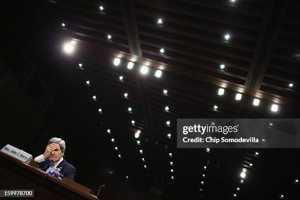 Sen. John Kerry testifies during his confirmation hearing before the Senate Foreign Relations Committee to become the next Secretary of State in the...