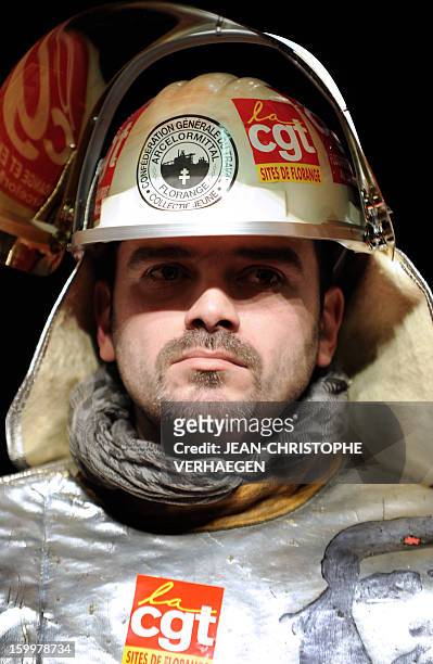 ArcelorMittal unionist of French trade union CGT wearing steelmaker helmet and clothes is pictured on January 23, 2013 in Metz, eastern France,...
