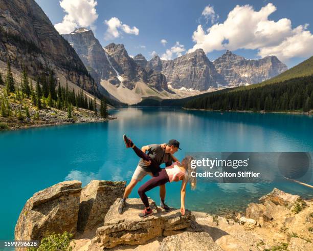 a young couple at moraine lake - valley of the ten peaks stock pictures, royalty-free photos & images