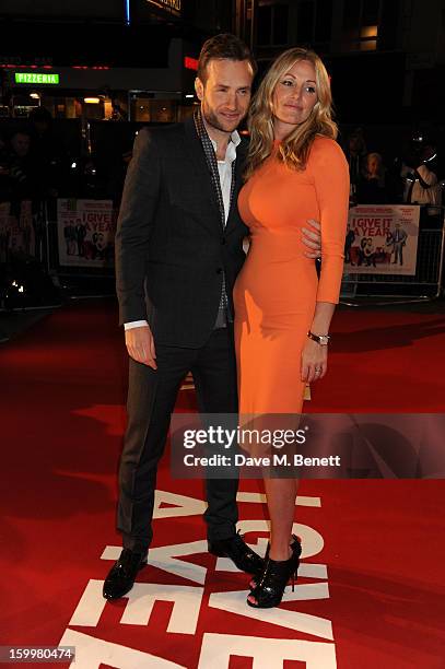 Elize Du Toit and Rafe Spall attend the European Premiere of 'I Give It A Year' at Vue West End on January 24, 2013 in London, England.