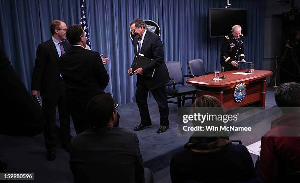 Defense Secretary Leon Panetta and Chairman of the Joint Chiefs of Staff General Martin Dempsey depart a ceremony where they signed orders that will...