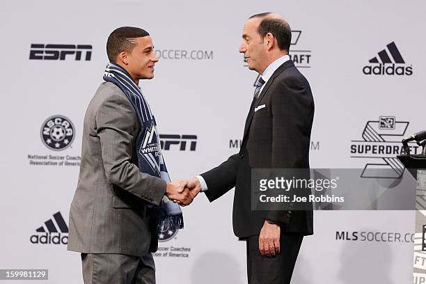 Erik Hurtado of Santa Clara shakes hands with commissioner Don Garber after being selected by Vancouver Whitecaps FC as the fifth overall pick in the...
