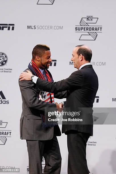 Andrew Farrell of Louisville shakes hands with commissioner Don Garber after being named the first selection of the New England Revolution in the...