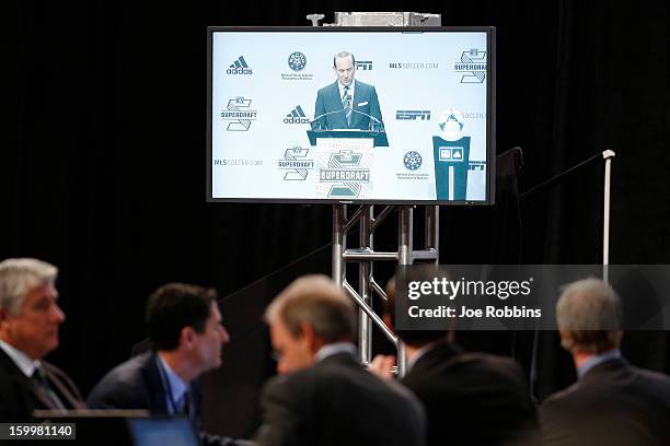 Commissioner Don Garber is seen on a television monitor speaking prior to the 2013 MLS SuperDraft Presented by Adidas at the Indiana Convention...