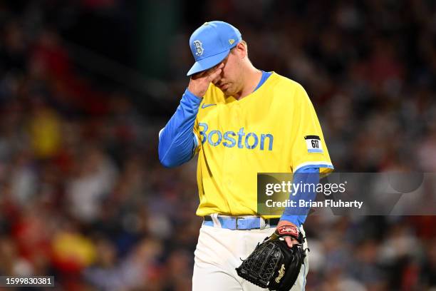 Josh Winckowski of the Boston Red Sox walks off of the field after allowing two runs in the seventh inning against the Kansas City Royals at Fenway...