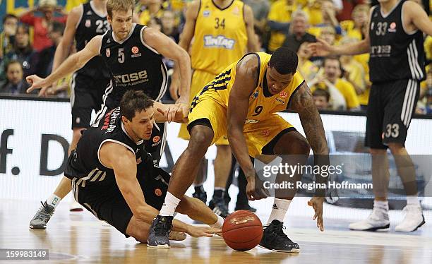 Bostjan Nachbar, #7 of Brose Baskets Bamberg competes with Deon Thompson, #9 of Alba Berlin during the 2012-2013 Turkish Airlines Euroleague Top 16...