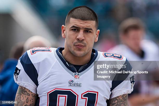 Tight end Aaron Hernandez of the New England Patriots looks on during an NFL game against the Jacksonville Jaguars at EverBank Field on December 23,...