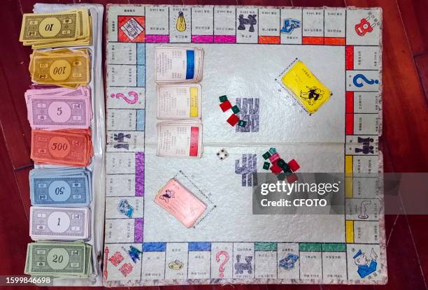 View of the classic old game Monopoly in Shanghai, China, August 14, 2023. Players split the game's money, buy real estate and build buildings to...