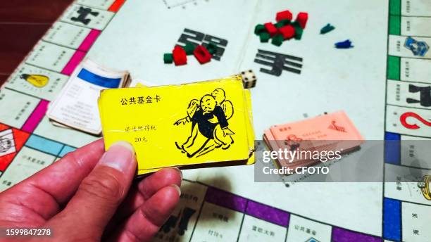 View of the classic old game Monopoly in Shanghai, China, August 14, 2023. Players split the game's money, buy real estate and build buildings to...