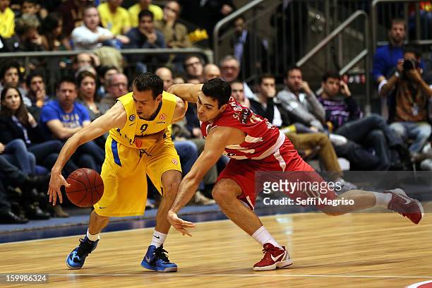 Moran Roth, #9 of Maccabi Electra Tel Aviv competes with Kostas Sloukas, #10 of Olympiacos Piraeus in action during the 2012-2013 Turkish Airlines...