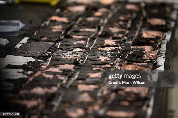 Table full of battery parts from a Japan Airlines 787 are displayed at the NTSB headquaters on January 24, 2013 in Washington, DC. The NTSB held a...