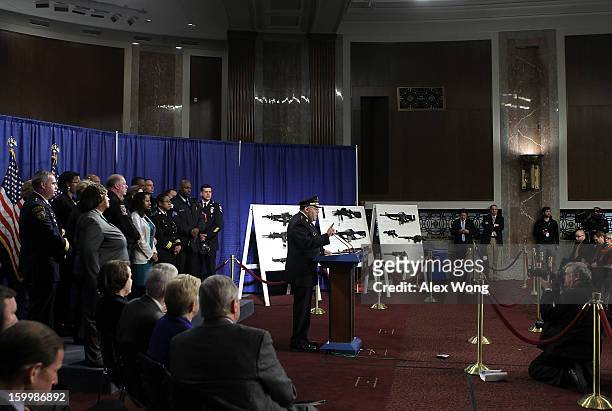 Philadelphia Police Department Commissioner Charles Ramsey speaks next to a display of assault weapons during a news conference January 24, 2013 on...