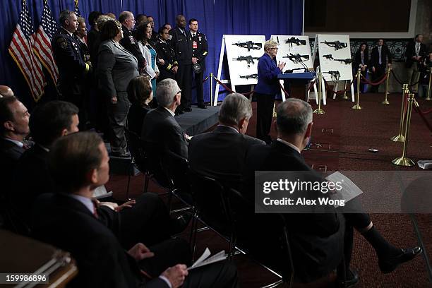 Representative Carolyn McCarthy speaks next to a display of assault weapons during a news conference January 24, 2013 on Capitol Hill in Washington,...