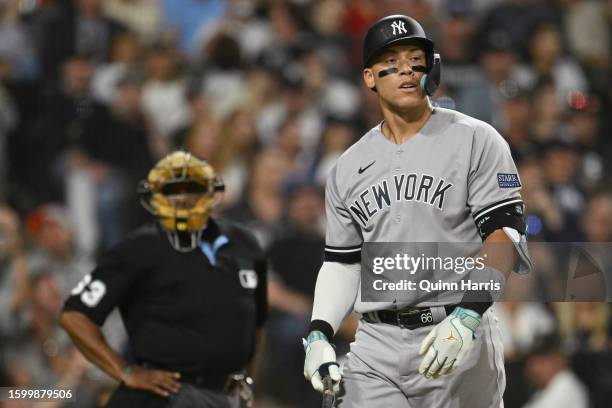 Aaron Judge of the New York Yankees walks back to the dugout after a called third strike by home plate umpire Laz Diaz in the fifth inning against...