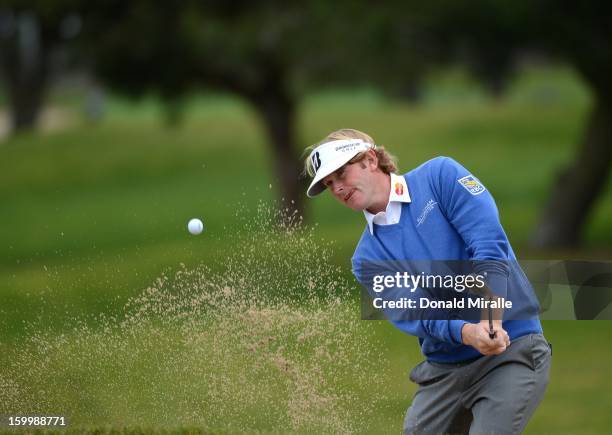 Brandt Snedeker hits out of a bunker during the First Round at the Farmers Insurance Open at Torrey Pines Golf Course on January 24, 2013 in La...