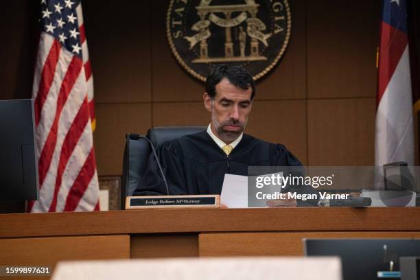 Fulton County Superior Court Judge Robert McBurney receives documents from the county court clerk on August 14, 2023 in Atlanta, Georgia. District...