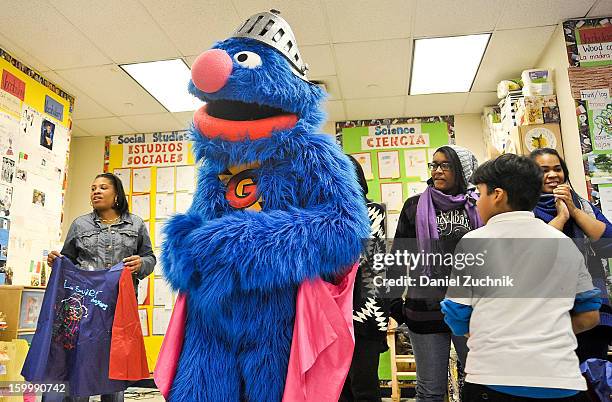 Super Grover teaches kids to be a super hero at the WHEDCo classroom on January 24, 2013 in New York City.