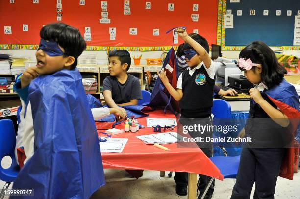 Super Grover teaches kids to be a super hero at the WHEDCo classroom on January 24, 2013 in New York City.