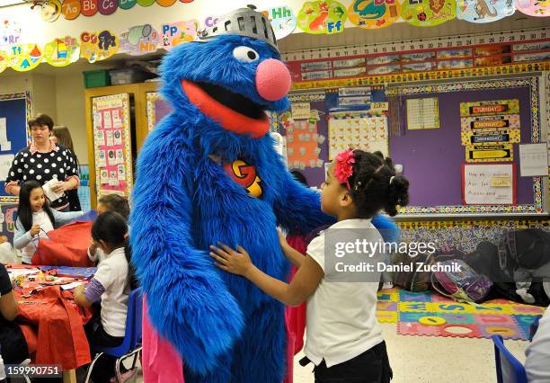 Super Grover teaches kids to be a super hero at the WHEDCo classroom on January 24, 2013 in New York City.