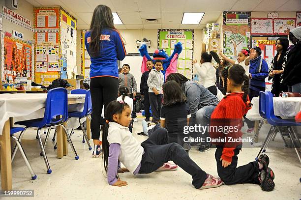 Super Grover teaches kids to be a super hero at the WHEDCo classroom on January 24, 2013 in New York City.